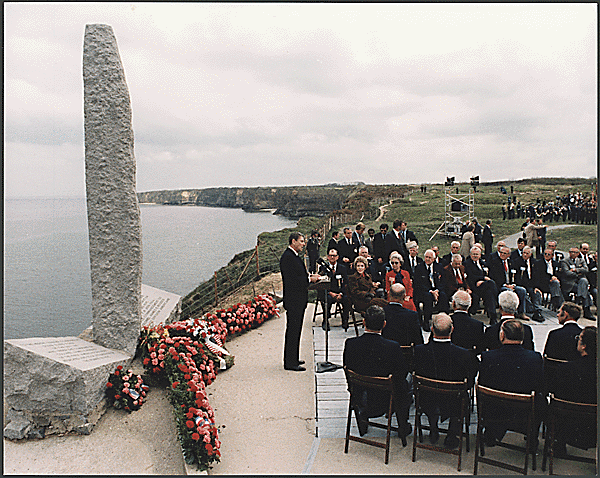 President Reagan giving a speech on the 40th Anniversary of D-Day at Pointe du Hoc, Normandy, France, 06/06/1984. Credit: National Archives.