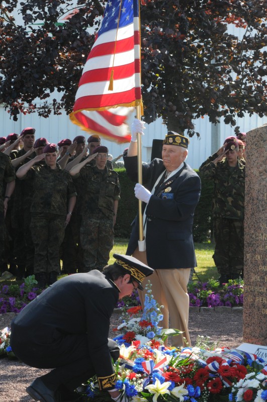 A general of the French Army lays down a wreath in front of the 101st Airborne Division memorial here during a commemoration ceremony June 3. The city of Carentan pays tribute to the 101st every year for liberating the city during World War II. Hundreds of Carentan citizens were on site to watch the ceremony as various military personnel from the United States, Germany, France and England laid wreaths near the memorial in honor of the brave soldiers who fought to free the city. Following the ceremony, all the military ceremonial personnel marched through the city and convened at the town hall where they socialized with the local citizens. The ceremony is one of many that honor the 67th anniversary of the Normandy invasion. Credit: Staff Sgt. Michael Taylor, DVIDSHUB.