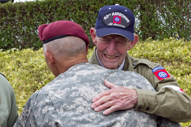 World War II veteran Fred Morgan, who jumped into Normandy as a paratrooper medic with the 82nd Airborne Division during the Allied invasion of France, embraces the current commanding general of the division, Maj. Gen. Jim Huggins June 5, 2011, at La Fiere, France. Morgan and another veteran medic were present for the dedication of a memorial plaque to Allied medics at a memorial to paratroopers. Credit: U.S. Army photo by Sgt. Michael J. MacLeod