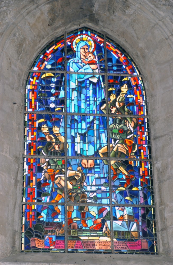 In the church of St Mere Eglise, France (FRA), this stained glass window shows the arrival of the US Army (USA) 82nd Airborne paratroopers as they were dropped over the town on D-Day, June 6, 1944: 06/04/2004. Image and caption credit: National Archives.