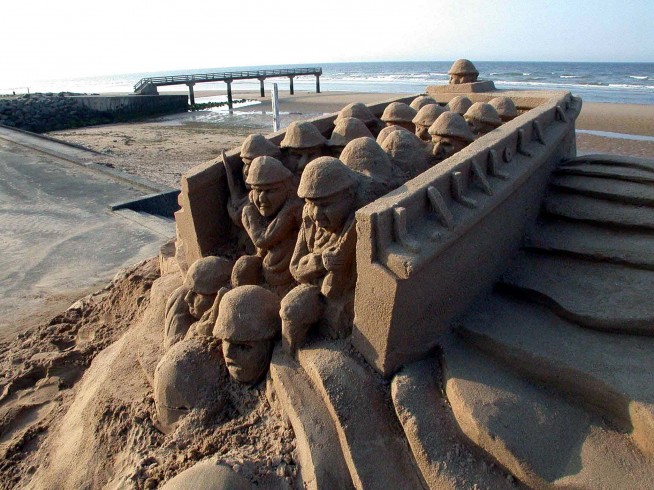 A sand sculpture of troops disembarking from a landing craft during the June 6, 1944, D-Day invasion of the beaches of Normandy, France. Photo by Bernard Clerc-Renaud, June 29, 2004. Caption: DoD.