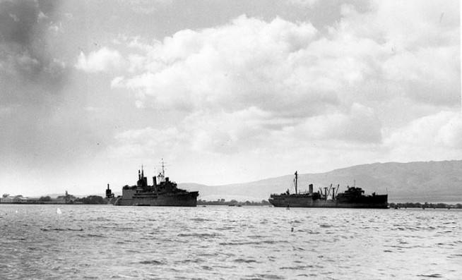 The damaged USS Curtiss (AV-4), at left, and USS Medusa (AR-1), at right, at their moorings soon after the Japanese raid. Note that Curtiss has been fitted with an air search radar. Official U.S. Navy Photograph, National Archives. Caption: Naval History & Heritage Command.