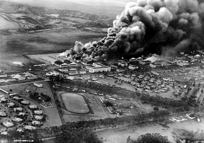 Planes and hangars burning at Wheeler Army Air Field, Oahu, soon after it was attacked in the morning of 7 December 1941, as seen from a Japanese Navy plane. Photo & Caption: Naval History & Heritage Command.