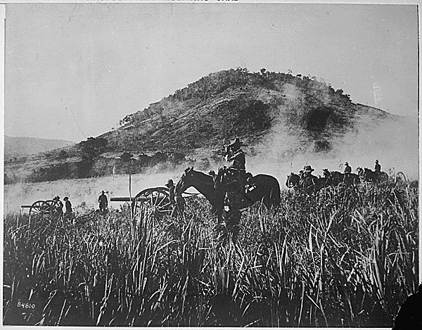 Battery B, 4th Artillery, shelling the blockhouse at Coamo, Porto Rico., 08/09/1898. Credit: National Archives.