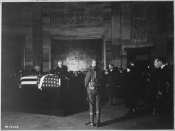 President Harding placing wreath of flowers on casket of Unknown Soldier in rotunda of the Capitol., 11/09/1921. Credit: National Archives.