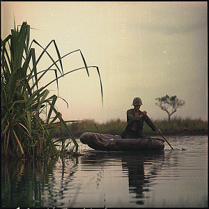 Private First Class David Sletten, medic, Company B, !st Battalion, 27th Infantry, 25th Infantry Division, paddles a three-man assault boat down the canal toward a breaking point during Operation Tong Thang I., 05/13/1968. Credit: National Archives.