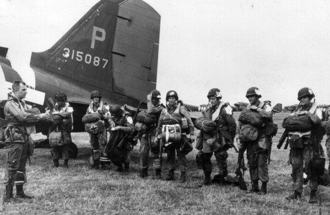 Paratroopers get final instructions before leaving for Normandy. Image and caption credit: U.S. Army Center of Military History.