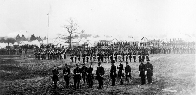 Dismounted parade of the 7th New York Cavalry in camp, 1862. Some mounted troops are in the background. Image and caption credit: National Archives.