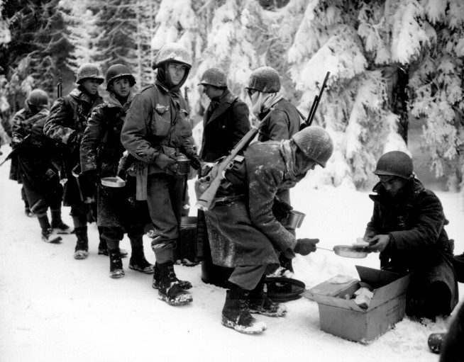 Chow is served to American Infantrymen on their way to La Roche, Belgium. 347th Infantry Regiment." Newhouse, January 13, 1945. Image and caption credit: National Archives.