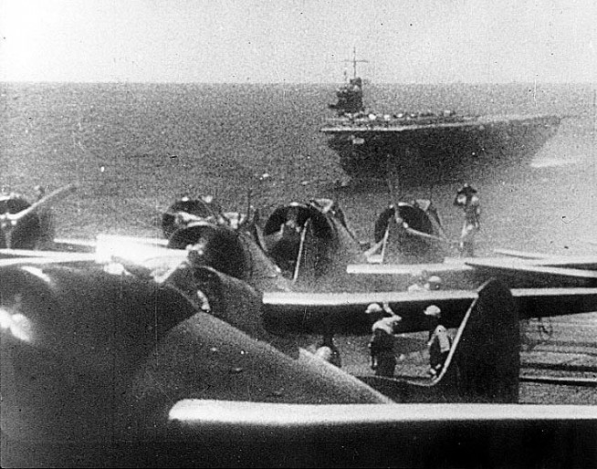 Japanese Navy Type 99 Carrier Bombers ("Val") prepare to take off from an aircraft carrier during the morning of 7 December 1941. Ship in the background is the carrier Soryu. Official U.S. Navy Photograph, National Archives Collection. Caption: Naval History & Heritage Command.