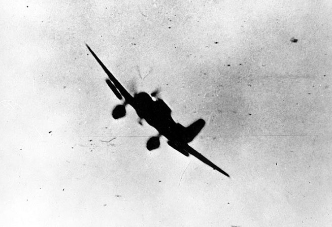 Japanese Navy Type 99 Carrier Bomber ("Val") in action during the attack. Official U.S. Navy Photograph, National Archives Collection. Caption: Naval History & Heritage Command.