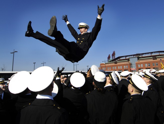 Philadelphia (Dec. 2, 2006) - U.S. Navy Midshipman Stan Jett is thrown into the air during pre-game activities at the Army-Navy football game at Lincoln Financial Field in Philadelphia. Naval Academy Midshipmen took on the West Point Black Knights in the 107th meeting between the two service schools. Navy won the game 26-14 over the Army Black Knights. Department of Defense photo by Staff Sgt. D. Myles Cullen. Caption: U.S. Navy. 
