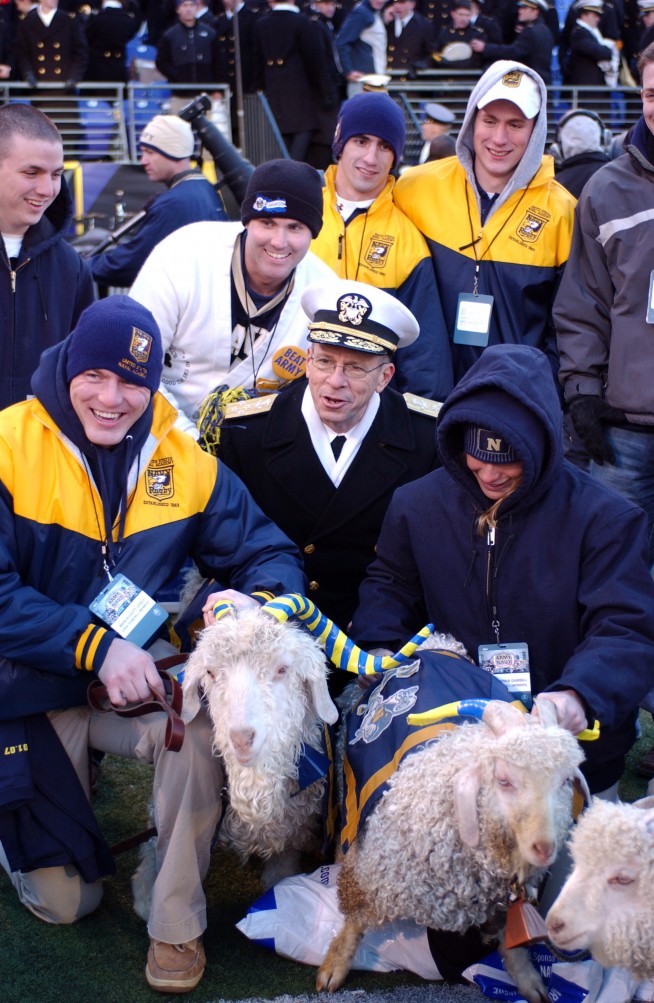 BALTIMORE, Md. (Dec. 1, 2007) Chairman of the Joint Chiefs of Staff Adm. Mike Mullen poses with the Naval Academy mascots during the 108th annual Army-Navy game at the M&T Bank Stadium, Baltimore, Md. Navy's historic sixth straight win over Army after a 38-3 victory puts the Midshipmen 52-49-7 against the Black Knights. U.S. Navy photo by Mass Communication Specialist 3rd Class Christopher Lussier. Caption: U.S. Navy. 