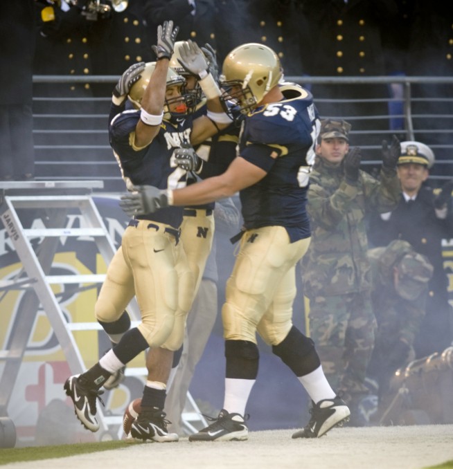 BALTIMORE, Md. M&T Bank Stadium (Dec. 1, 2007) U.S. Naval Academy senior slot back Zerbin Singleton (28) celebrates with his team after scoring the first touchdown during the Midshipmen's 38-3 victory at the 108th playing of the Army-Navy football game. U.S. Navy photo by Mass Communication Specialist 1st Class Chad J. McNeeley. Caption: U.S. Navy. 