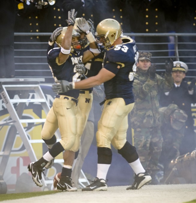 BALTIMORE, Md. M&T Bank Stadium (Dec. 1, 2007) U.S. Naval Academy senior slot back Zerbin Singleton (28) celebrates with his team after scoring the first touchdown during the Midshipmen's 38-3 victory at the 108th playing of the Army-Navy football game. U.S. Navy photo by Mass Communication Specialist 1st Class Chad J. McNeeley. Caption: U.S. Navy.