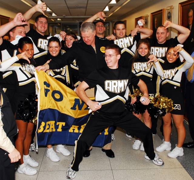 2008: Chief of Naval Operations Adm. Gary Roughead banters with West Point's Army Spirit Pep Band. Photo Credit: J.D. Leipold. Caption: U.S. Army. 