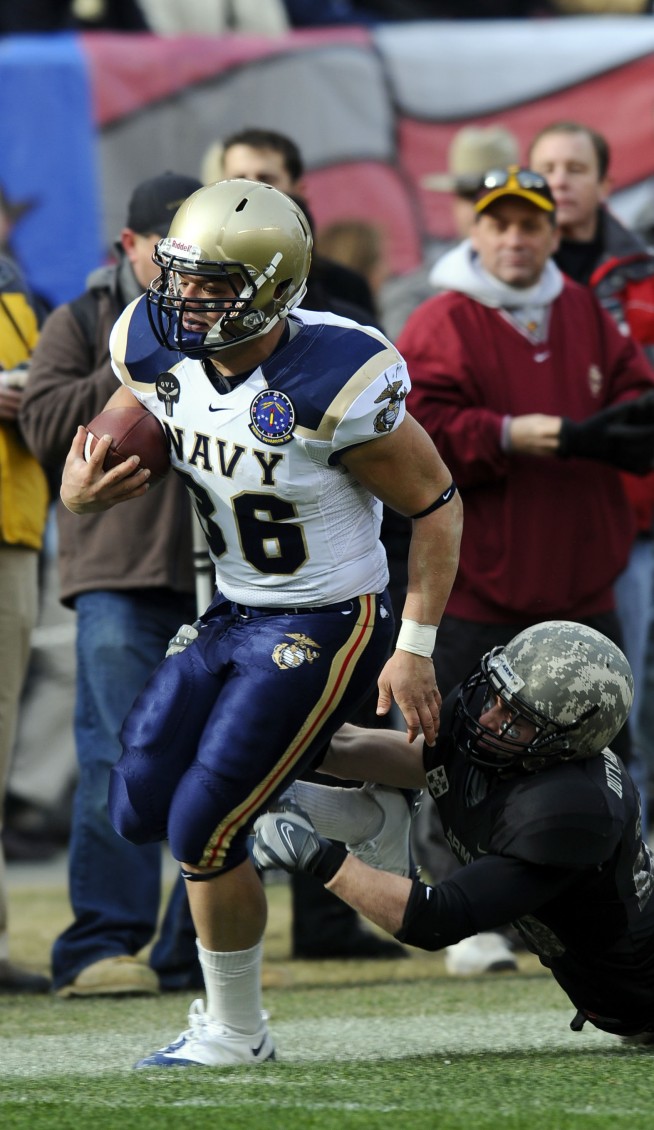 PHILADELPHIA (Dec. 6, 2008) U.S. Naval Academy fullback Eric Kettani (#36) gets past a U.S. Military defender during first half of the 109th Army-Navy college football game at Lincoln Financial Field in Philadelphia. (U.S. Navy photo by Mass Communication Specialist 2nd Class Kristopher Wilson. Caption: U.S. Navy. 