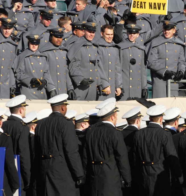 Midshipmen from the U.S. Naval Academy march past Army cadets before the start of the 110th Army Navy game at Lincoln Financial Field in Philadelphia, Pa., Dec. 12, 2009. The Army Navy game is a tradition dating to 1890. It is the last regular-season college football game and places inter-service "bragging rights" on the line. Photo: 1st Sgt. Robert Hyatt. Caption: DVIDSHUB. 