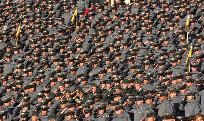 Cadets from the U.S. Military Academy at West Point, N.Y., render honors during the playing of the national anthem before the start of the 110th Army Navy game at Lincoln Financial Field in Philadelphia, Pa., Dec. 12, 2009. Photo Credit: 1st Sgt. Robert Hyatt. Caption: U.S. Army.