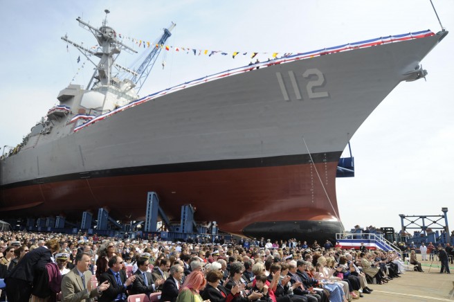 Guests await the christening ceremony for the Arleigh Burke-class guided-missile destroyer Pre-commissioning Unit (PCU) Michael Murphy (DDG 112) at General Dynamics Bath Iron Works in Bath, Maine. Michael Murphy was christened by Maureen Murphy, mother of the ship’s namesake, Navy (SEAL) Lt. Michael Murphy. Murphy was posthumously awarded the Medal of Honor for his actions during Operation Red Wings in Afghanistan in June 2005. He was the first Sailor awarded the Medal of Honor since the Vietnam War. Credit: Petty Officer 2nd Class Dominique M. Lasco, DVIDSHUB.