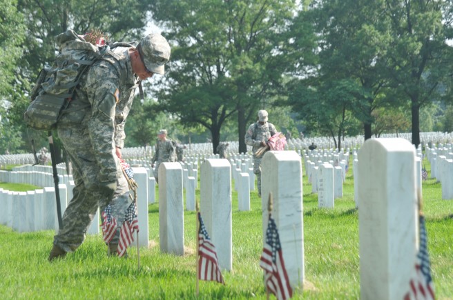 The 3rd U.S. Infantry Regiment (The Old Guard), Arlington National Cemetery, places flags in preparation for Memorial Day. May 26, 2011.  Credit: DVIDSHUB
