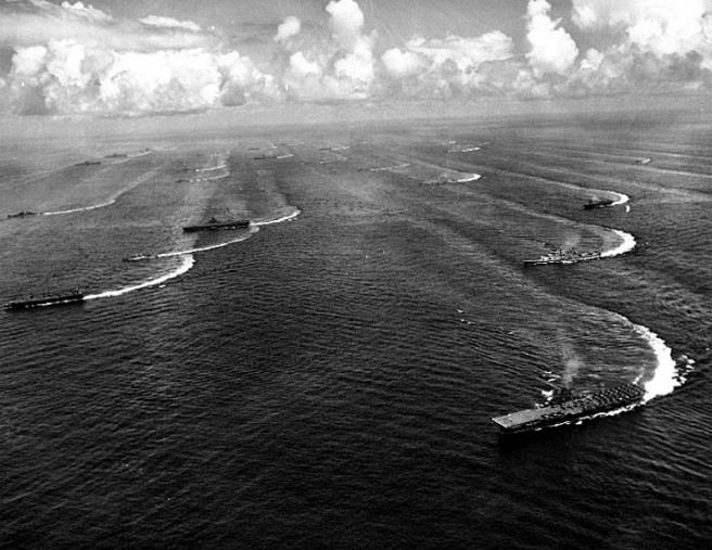 Maneuvering off the coast of Japan, 17 August 1945, two days after Japan agreed to surrender. Taken by a USS Shangri-La (CV-38) photographer. The aircraft carrier in lower right is USS Wasp (CV-18). Also present in the formation are five other Essex class carriers, four light carriers, at least three battleships, plus several cruisers and destroyers. Credit: Naval Historical Center.
