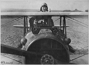 First Lieutenant E. V. Eddie Rickenbacker, 94th Aero Squadron, American ace, standing up in his Spad plane. Near Rembercourt, France in the Fall of 1918. Image in the public domain via OPA - Online Public Access