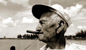 Gregorio Fuentes, Hemingway's model for The Old Man and the Sea smoked cigars right up until his death in 2002. This image is in the public domain via TheCuban History.com.