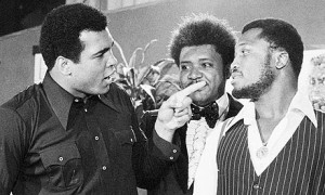 Muhammad Ali, left, points at the challenger Joe Frazier in New York City in May 1975, the build-up to the 'Thrilla in Manila' later that year. Image is in the public domain via The Liberal OC