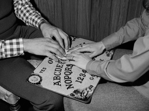 The Ouija Board was marketed as both mystical oracle and as family entertainment, fun with an element of other-worldly excitement. Image is in the public domain via Smithsonian.com Source (Bettmann/CORBIS)</em