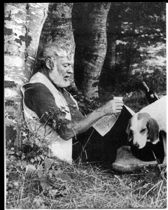 Photo of Ernest at our picnic at the Irati River when a gentle hound mysteriously appeared out of the adjoining forest. Pamplona, Spain. Image is taken from the book Hemingway in Love by A. E. Hotchner
