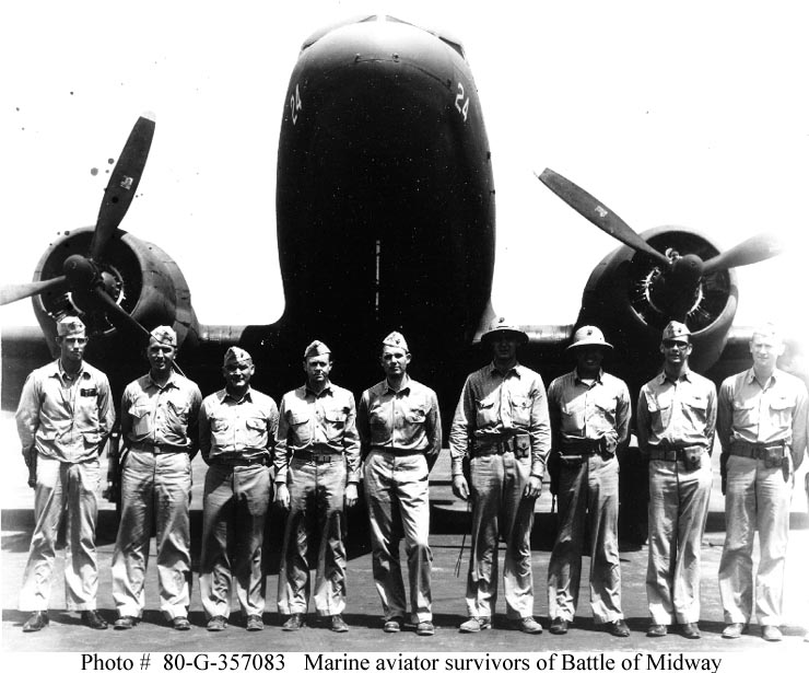 Survivors of the Battle of Midway at Ewa Mooring Mast Field, Oahu on 22 June 1942. From left to right: Capt Marion E. Carl; Capt Kirk Armistead; Maj Raymond Scollin (of Marine Air Group 22); Capt Herbert T. Merrill; 2nd Lt Charles M. Kunz; 2nd Lt Charles S. Hughes; 2nd Lt Hyde Phillips; Capt Philip R. White and 2nd Lt Roy A. Corry, Jr. By United States Navy - Official U.S. Navy Photograph 80-G-357083, now in the collections of the National Archives. Image is in the public domain via Wikimedia.com</em