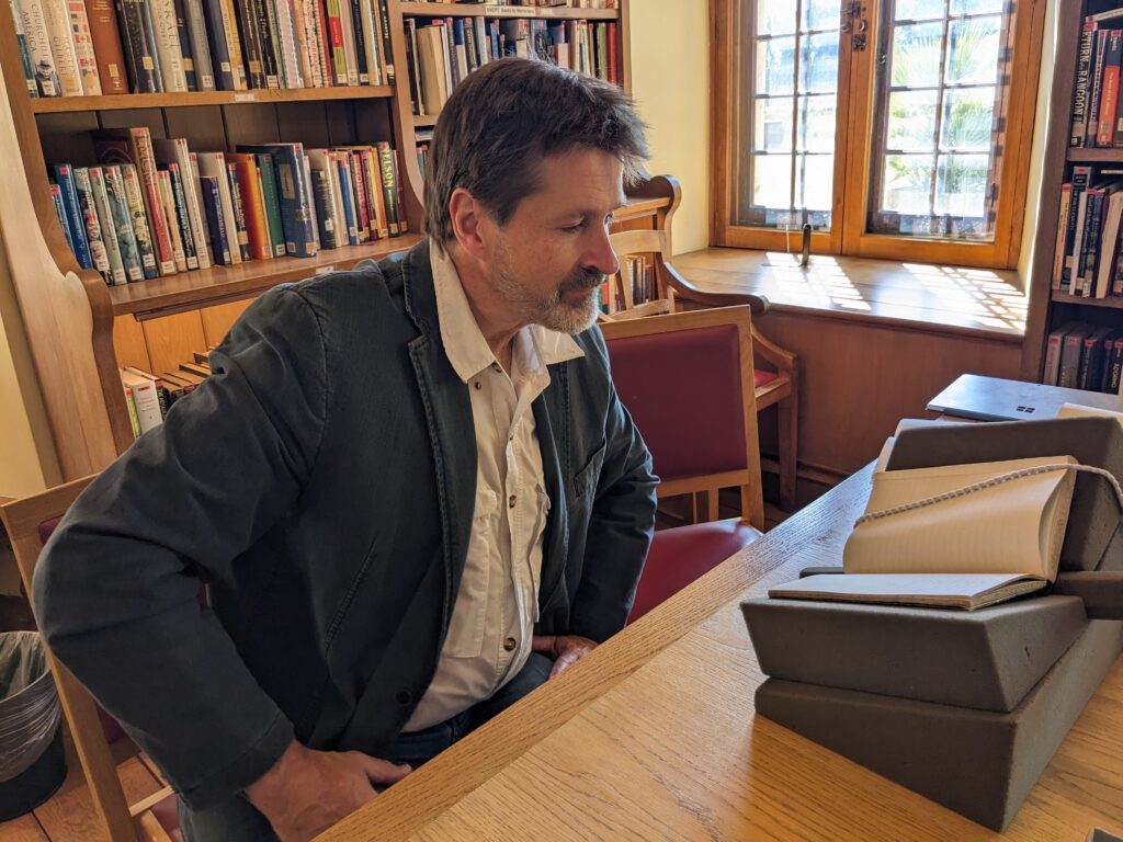 Jochen Hemmleb reading Sandy's diary at Merton College, May 2025
